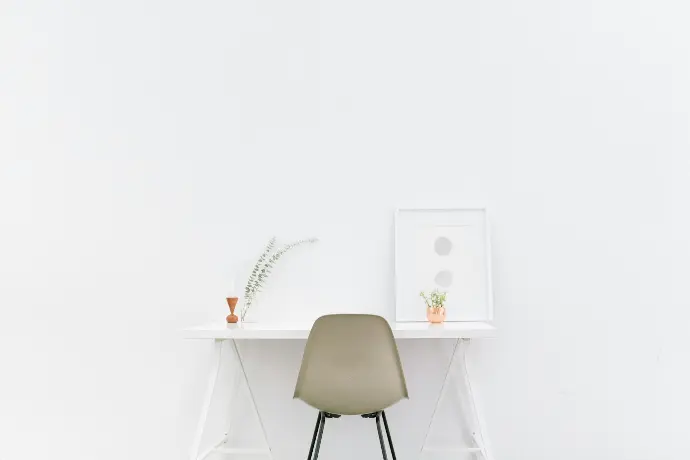 white wooden table near brown chair